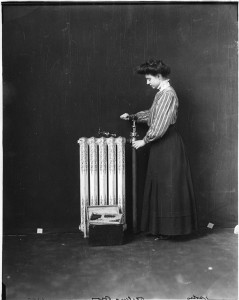 woman fixing a radiator